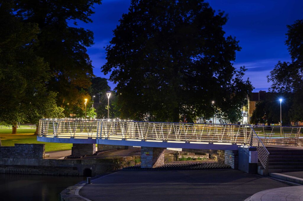 retrofit handrail on a bridge within a park